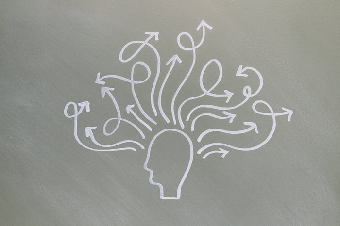 Illustration of a human head with arrows indicating various directions.